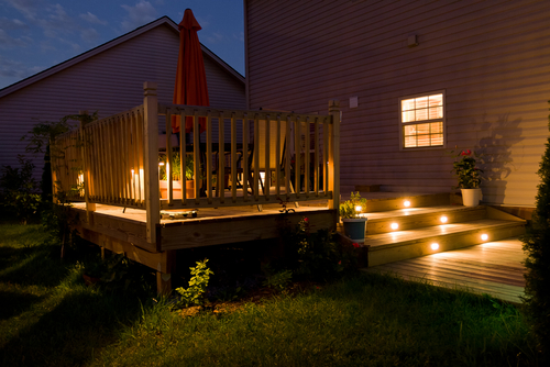 A deck being lit by deck lighting